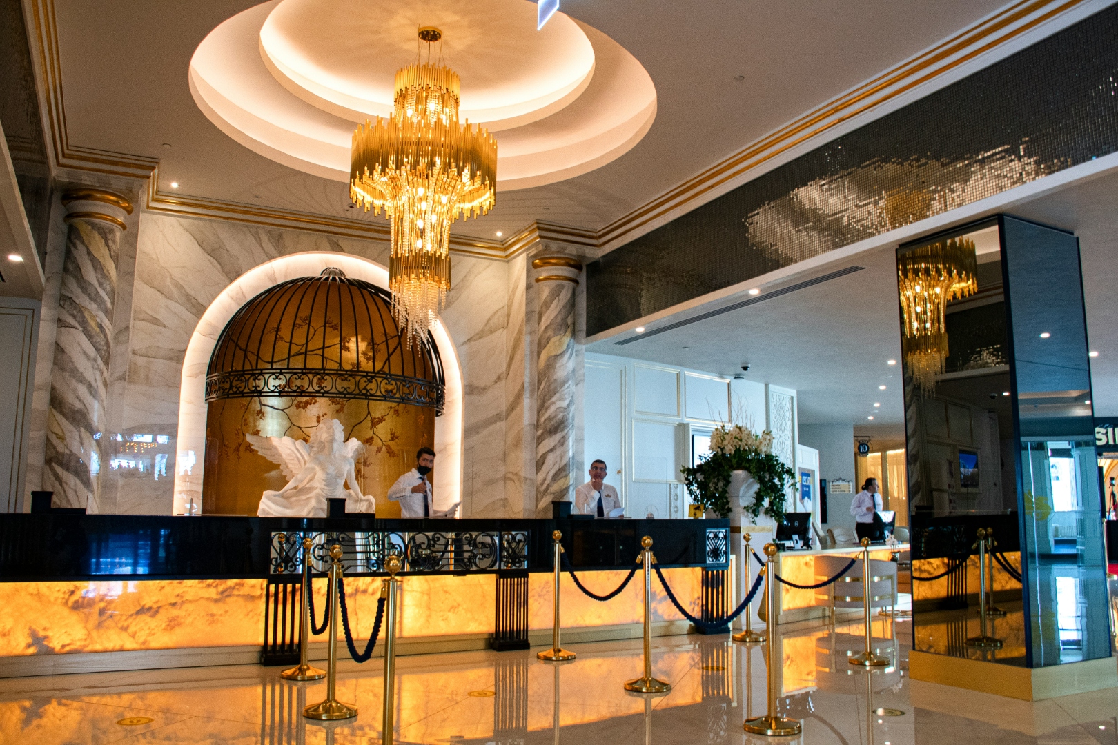 Luxury hotel lobby with golden chandelier